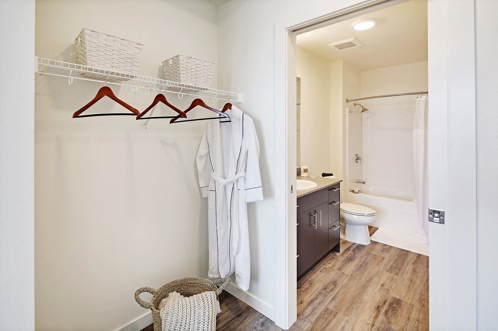 a bathroom with a shower and a sink and a mirror