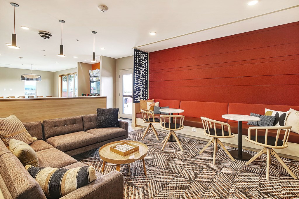 a living room with couches and chairs and tables