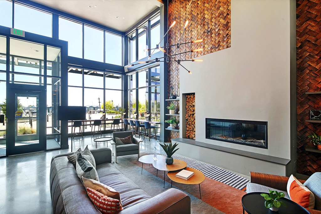 a living room with a large couch and a fireplace