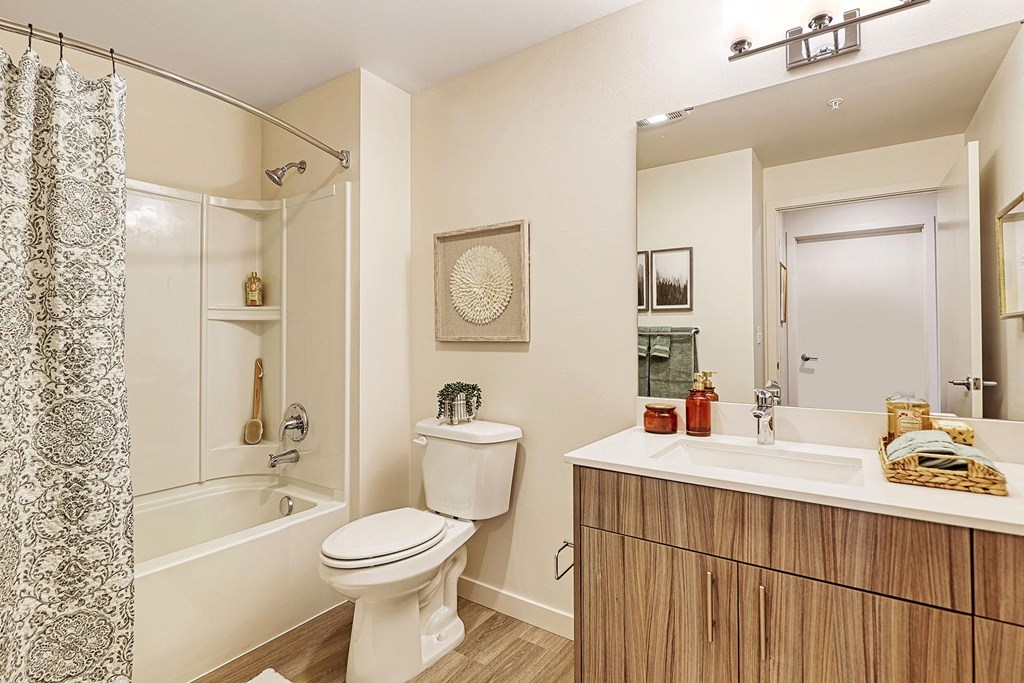a bathroom with a toilet sink and bathtub