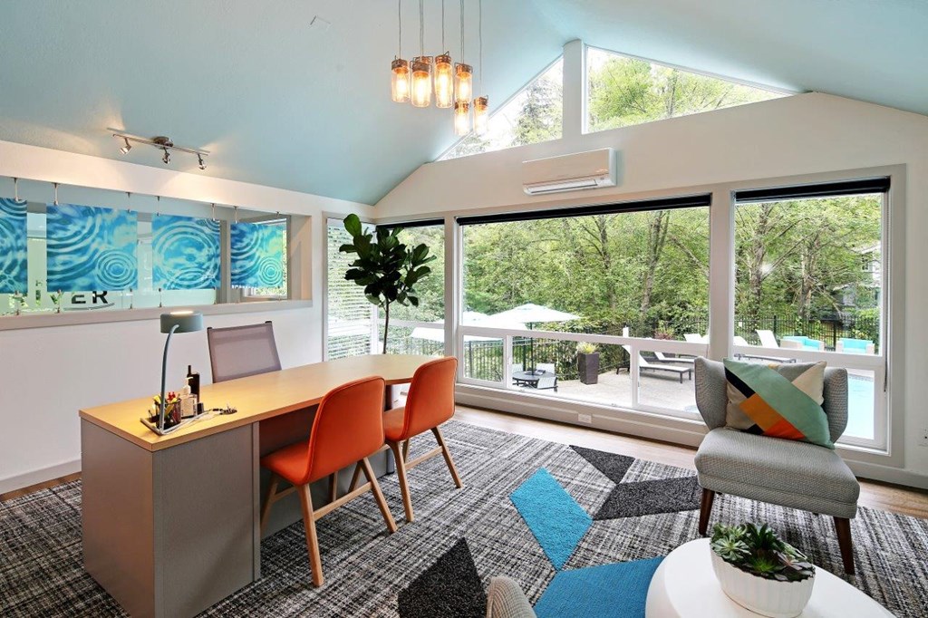 a dining room with a table and chairs