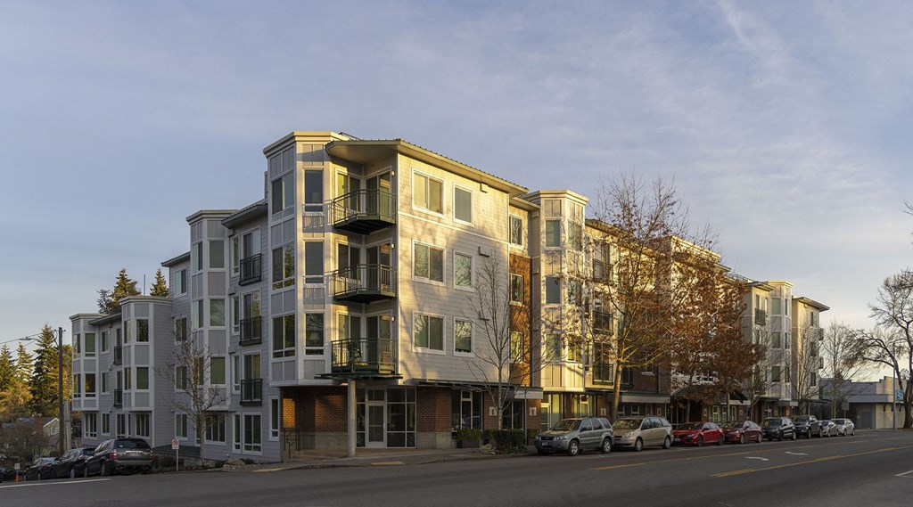 a rendering of an apartment building on a city street