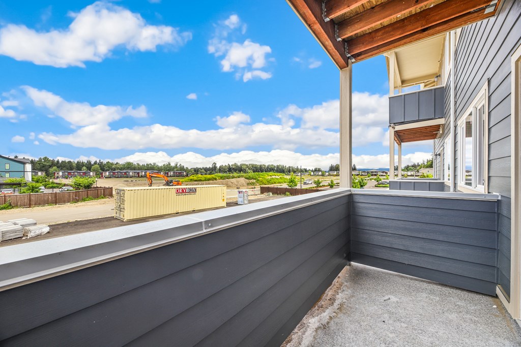 the balcony of a home with a view of the city