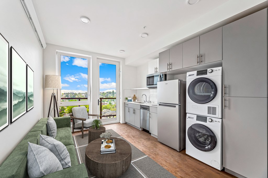 a living room with a washing machine and a washer and dryer in it
