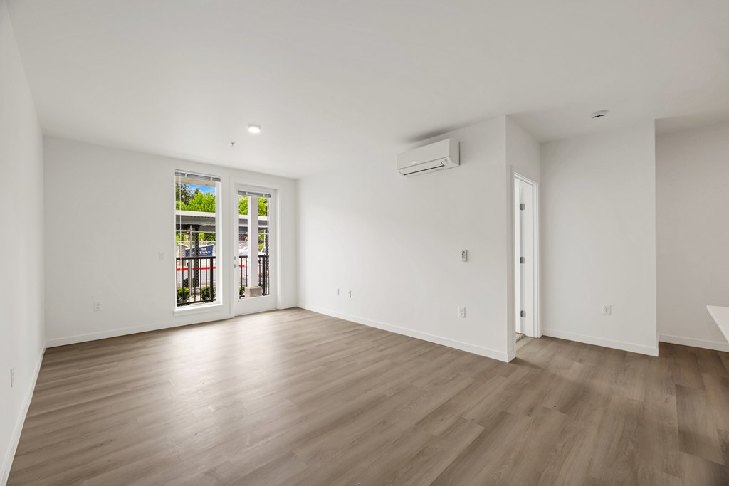A room with a window and a door.