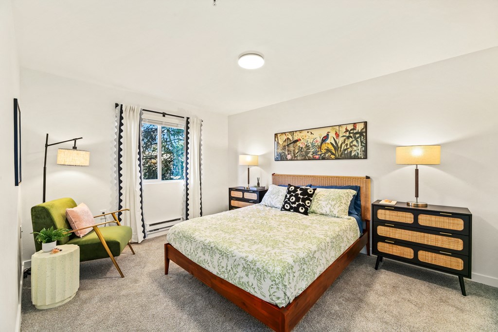 a bedroom with a bed and a chair