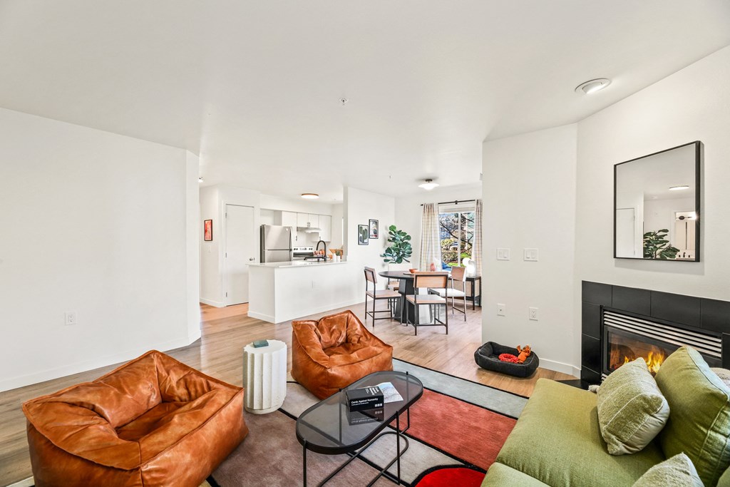 a living room with leather furniture and a fireplace