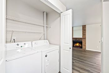 A laundry room with a washer and dryer in it.