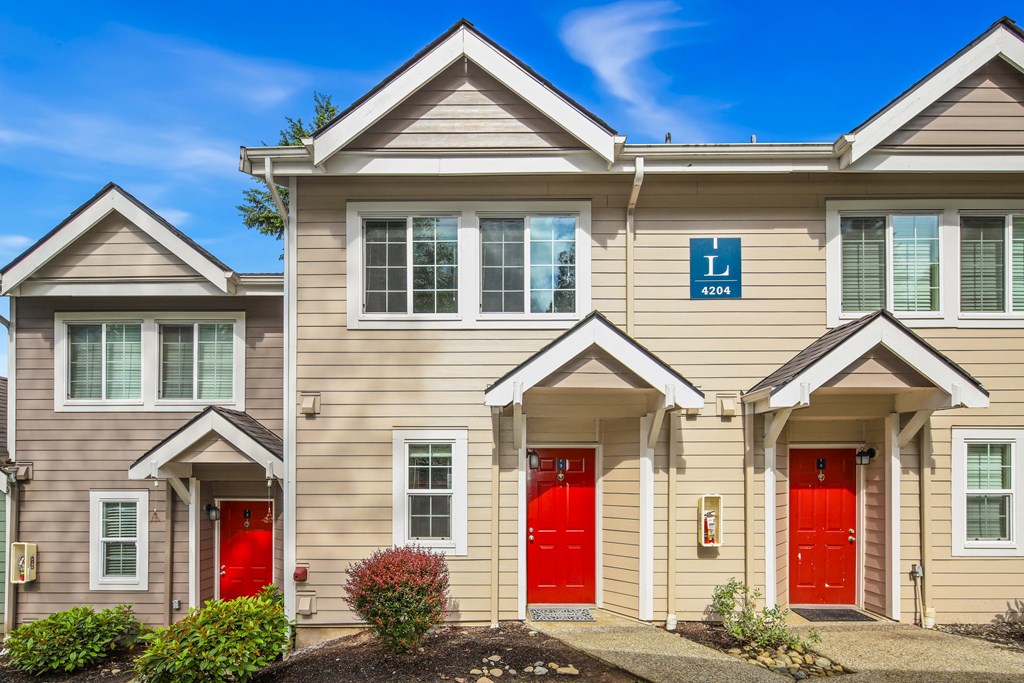 A building with a blue sign that says L and a number 4204 on it.