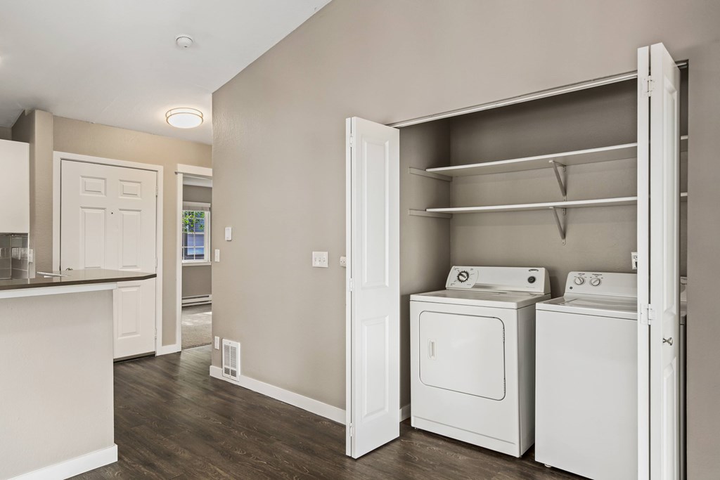 A laundry room with a washer and dryer in it.