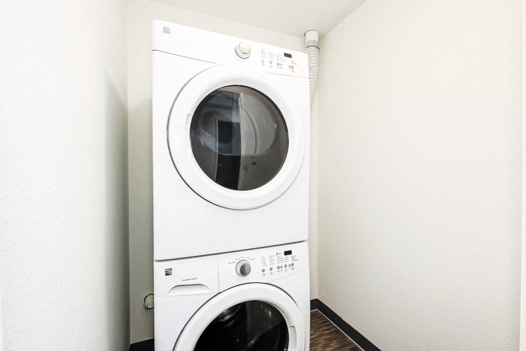 a white washer and dryer in a laundry room