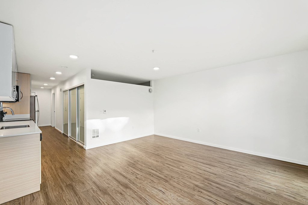 A room with wooden floors and white walls.
