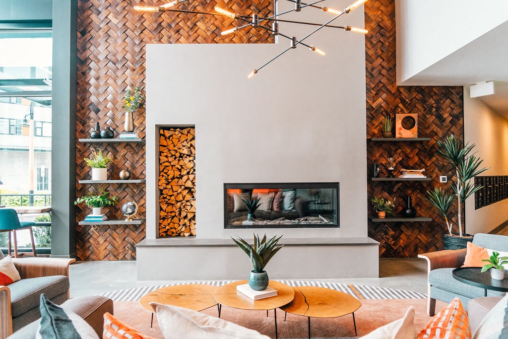 a living room with furniture and a fireplace