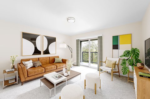 a living room with a brown couch and a sliding glass door