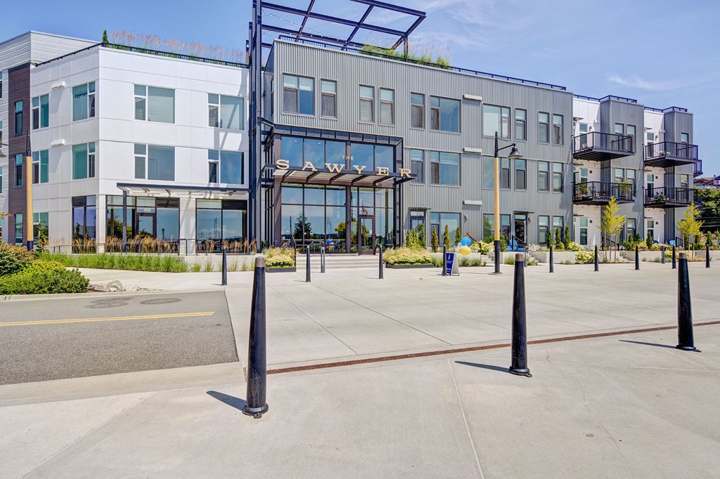 an empty parking lot in front of a building
