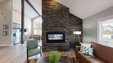 a living room with a couch and a fireplace