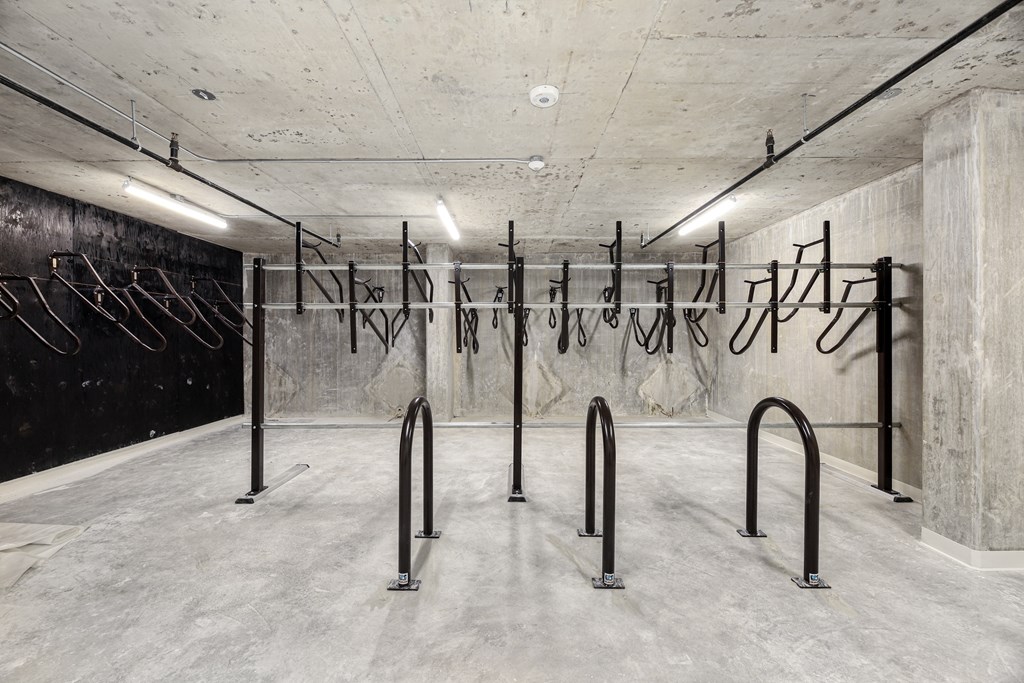 A concrete room with black railings and a wall with Chinese characters.