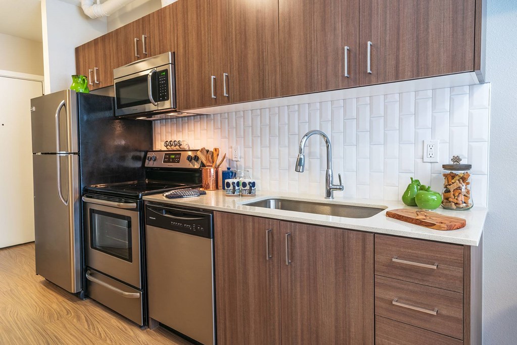 a kitchen with stainless steel appliances and a sink