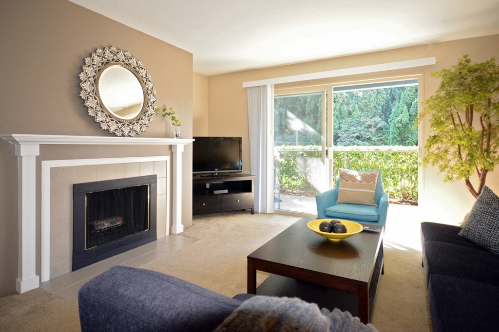 a living room with a fireplace and a couch