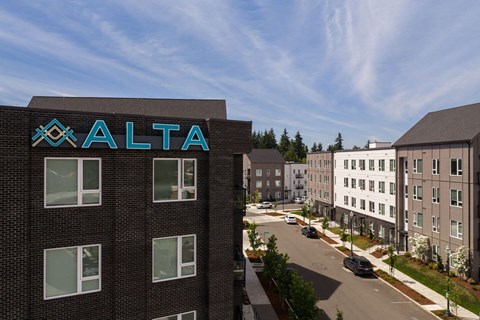 A street view of a building with the word "ALTA" on it.