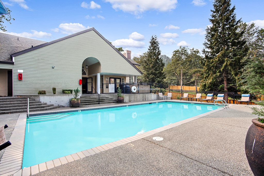 a swimming pool in front of a house