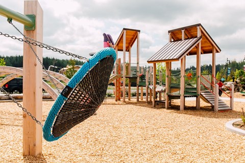 a hammock swing in a playground at a park
