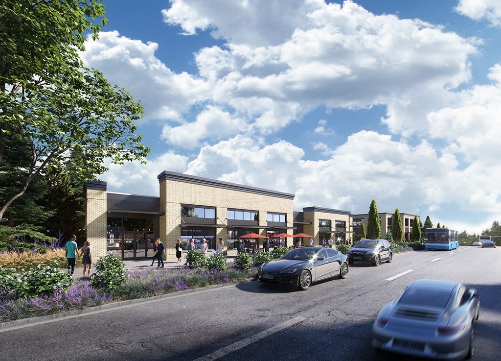 a rendering of a building with cars on the road