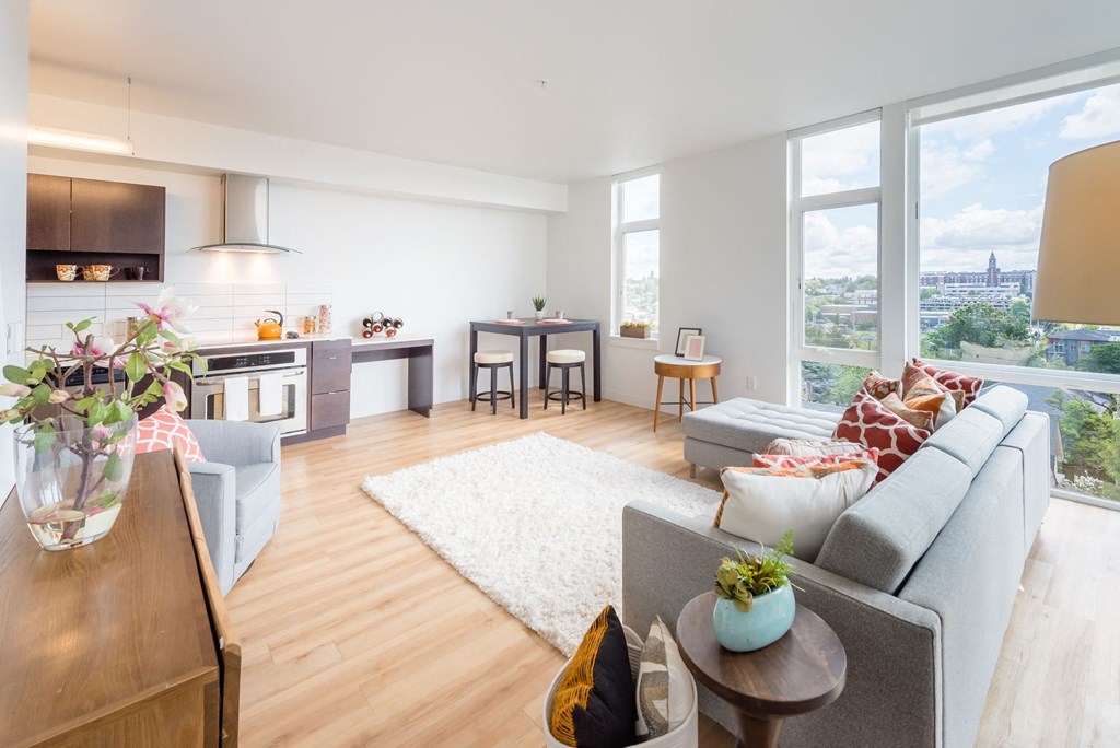 an open living room and kitchen with a view of the eiffel tower