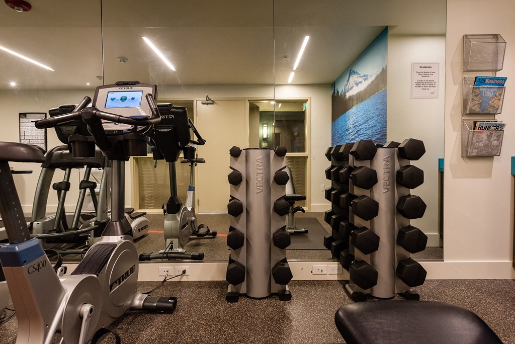 a room filled with lots of different types of exercise equipment