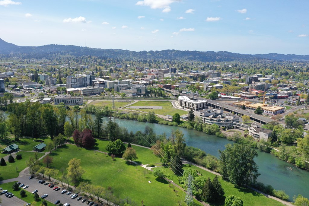 an aerial view of the city with a river