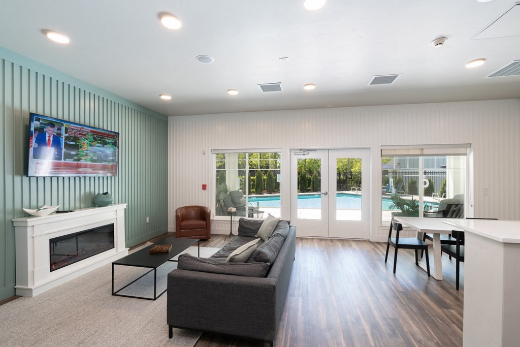 a living room with a couch and a table and a fireplace