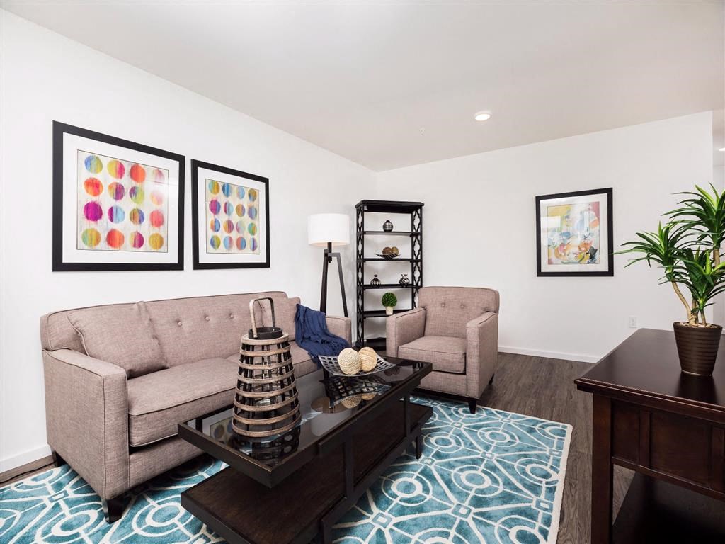 a living room with a couch and two chairs