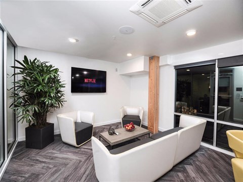 a living room with a white couch and a table