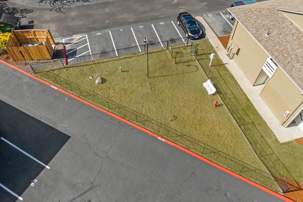 A parking lot with a car parked in it.