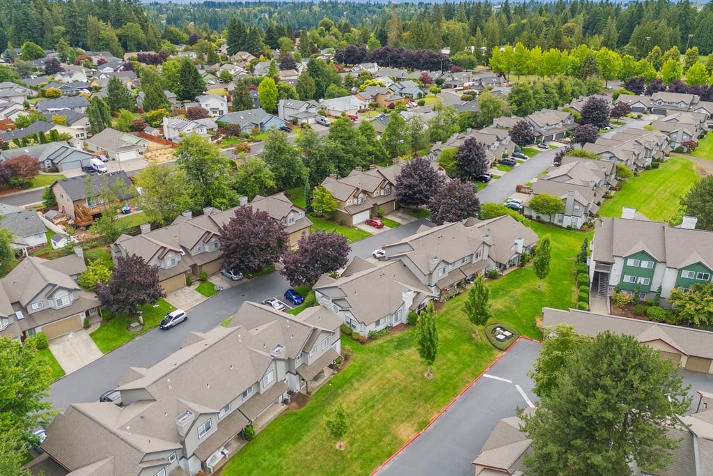 A residential area with houses and trees.