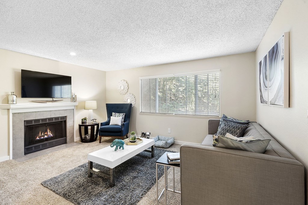 a living room with a fireplace and a couch