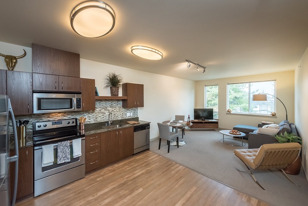 a kitchen and living room in a 555 waverly unit