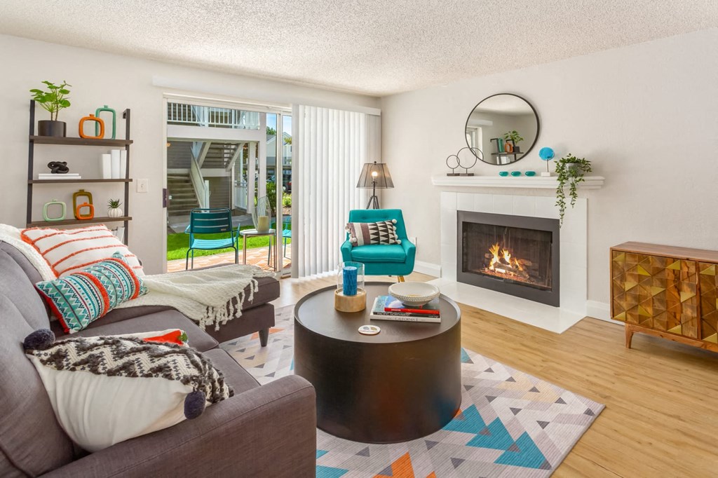 a living room with a fireplace and a couch