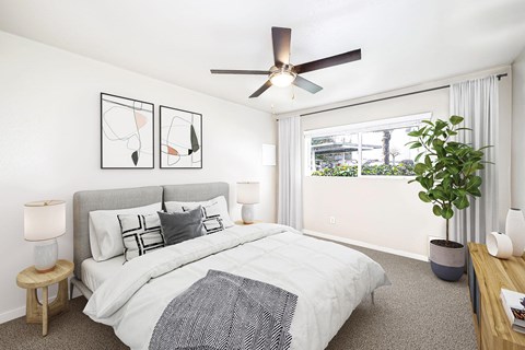 an image of a bedroom with a bed and a ceiling fan