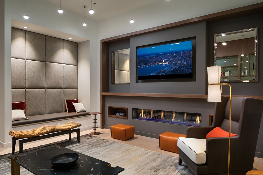 a large living room with a fireplace and a television