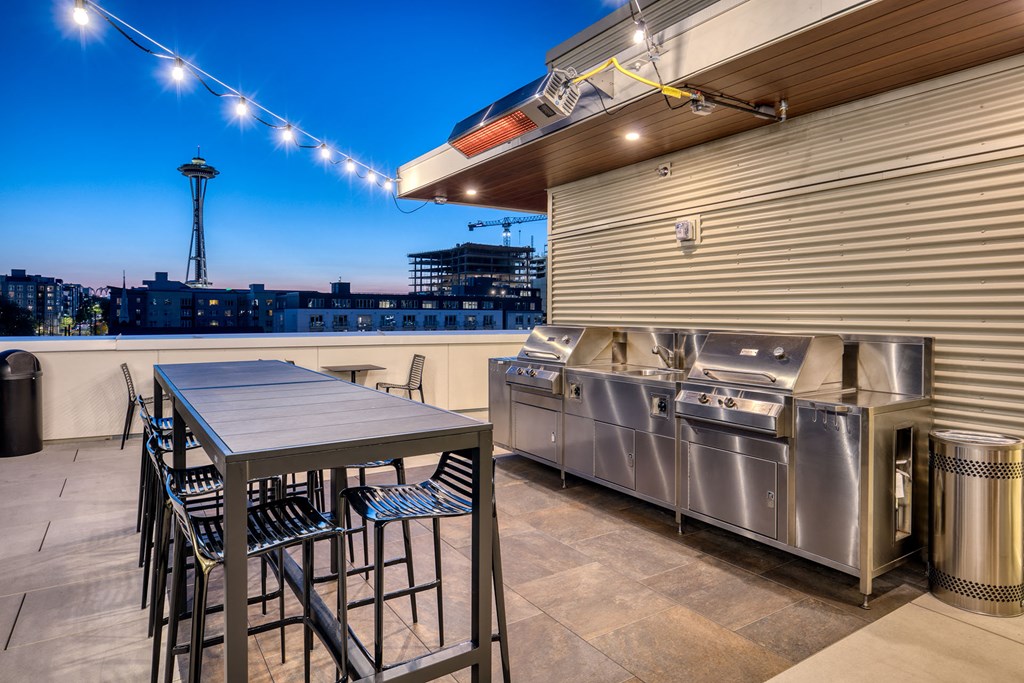 a kitchen with stainless steel appliances and a table