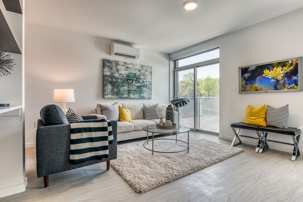 a living room with a couch and a chair