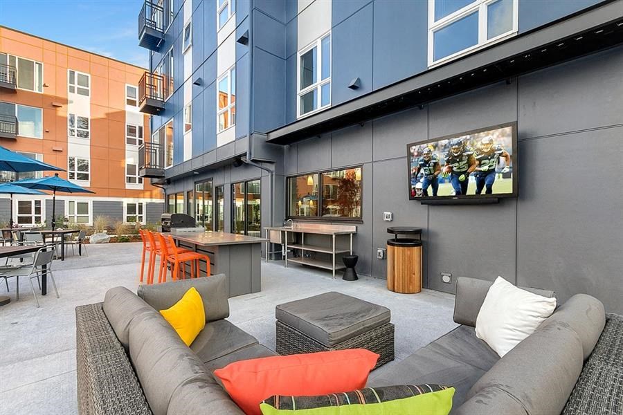 a living room with a couch and a tv
