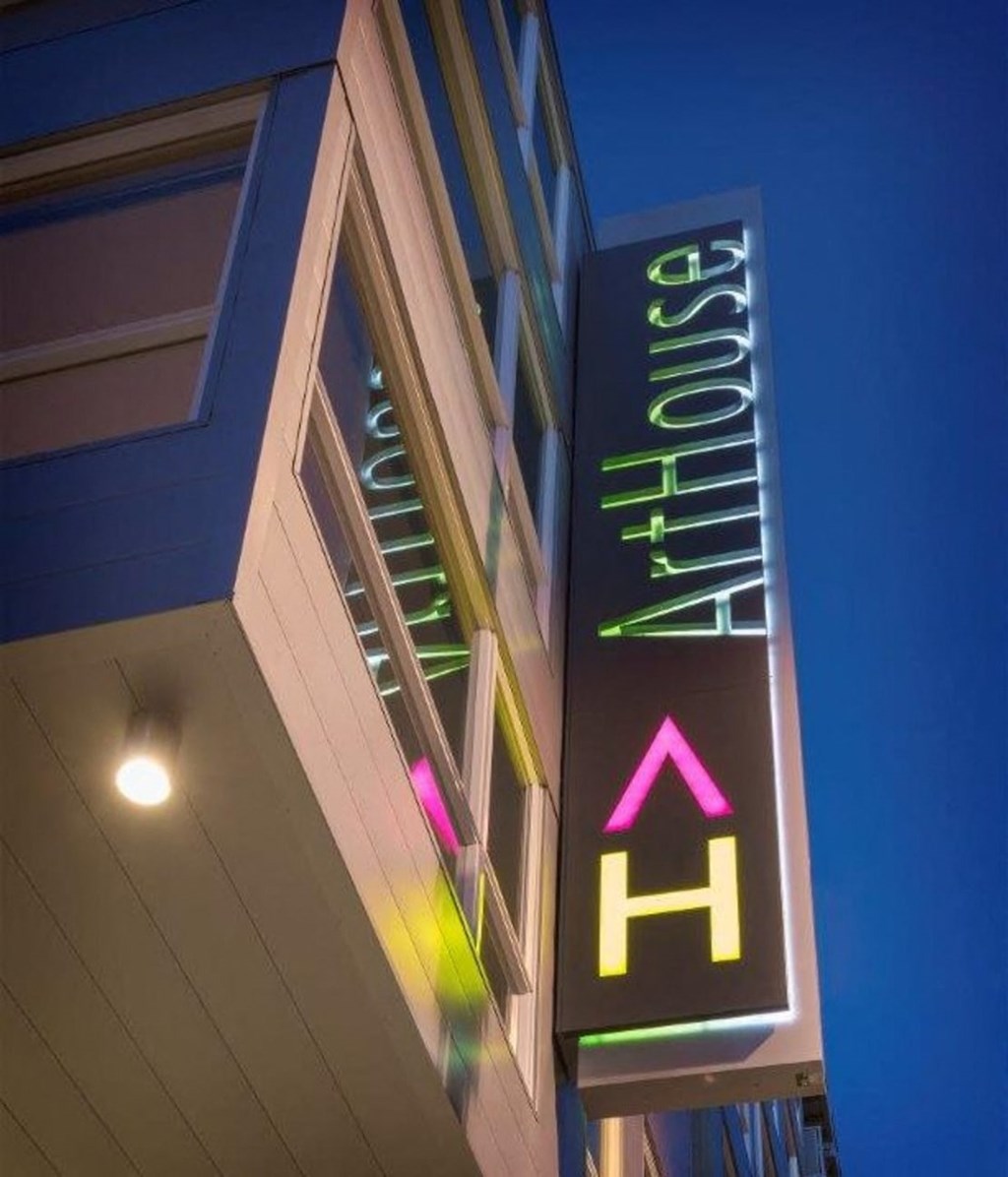 a neon sign outside of a building