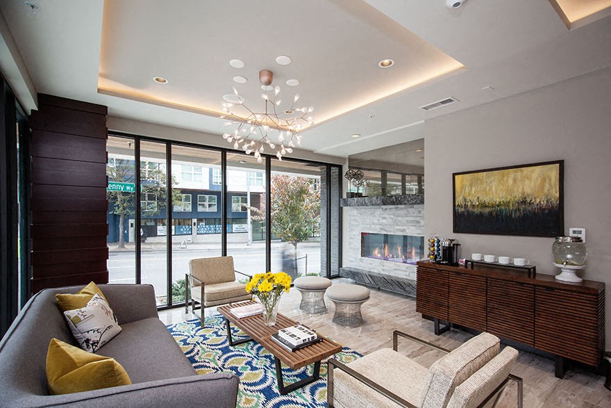 a living room with a fireplace and a large window