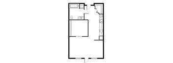 A floor plan of a room with a toilet, sink, and a large empty space.