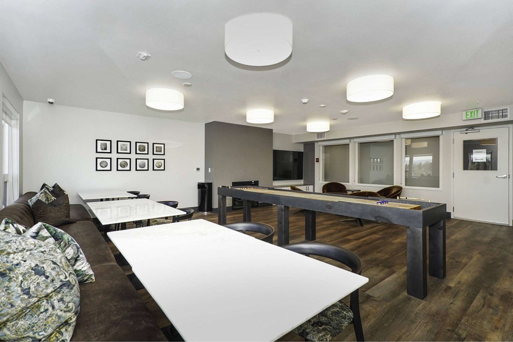 A conference room with a long table and chairs.