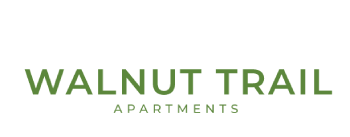 A sign that says Walnut Trail Apartments.