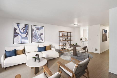 A living room with a white couch and a coffee table.
