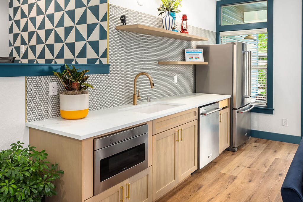 a kitchen with a sink and a refrigerator